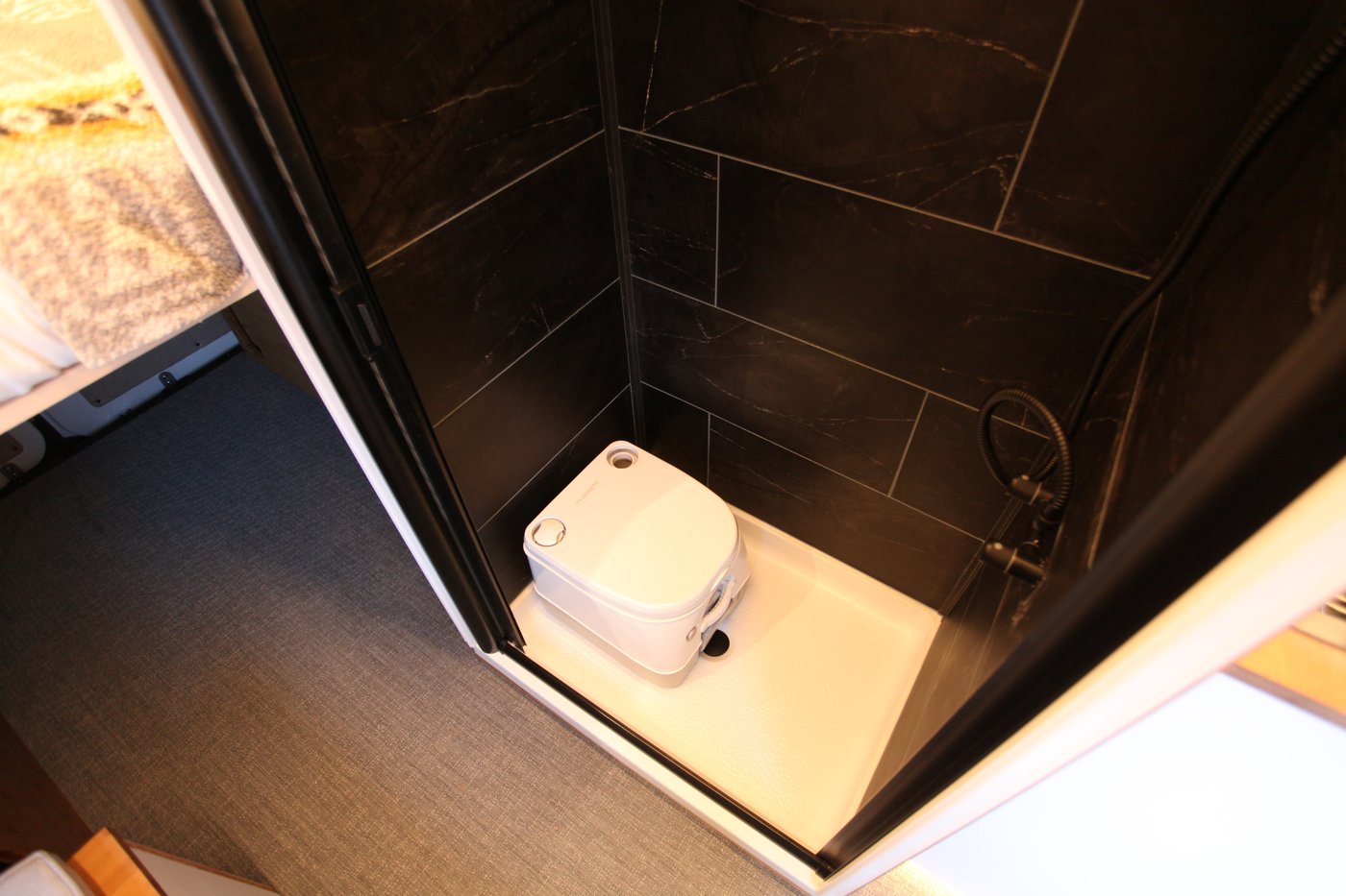 Atlas full-size shower with cassette toilet in the shower pan