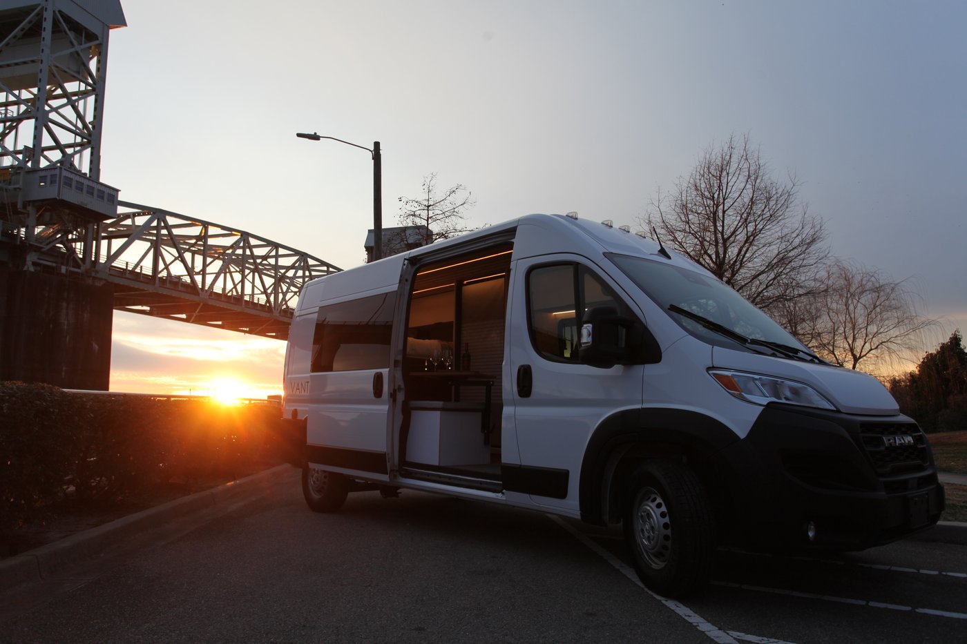 Passenger side of the Atlas camper van on a Ram ProMaster at sunset